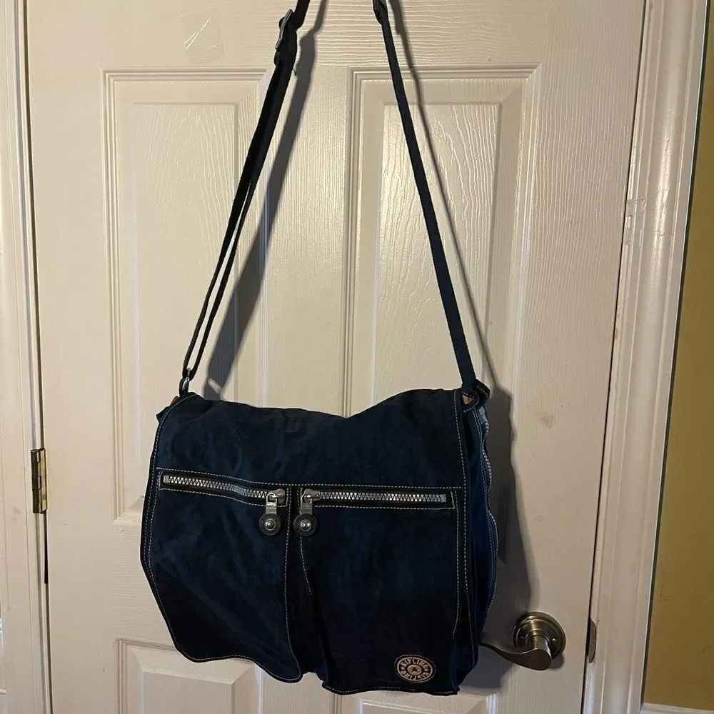 Kipling Nylon Expandable Navy Blue Large Messenger Bag Key Clip. Black strap .